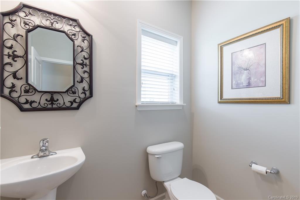 3347 Mandrake Court Tega Cay, SC 29708 - Photo 8 of 27 a bathroom with a toilet sink and mirror