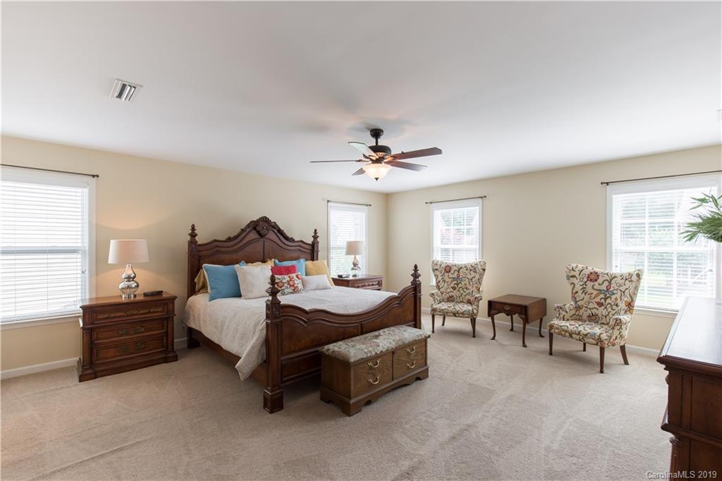 3347 Mandrake Court Tega Cay, SC 29708 - Photo 10 of 27 a spacious bedroom with a bed furniture and a window