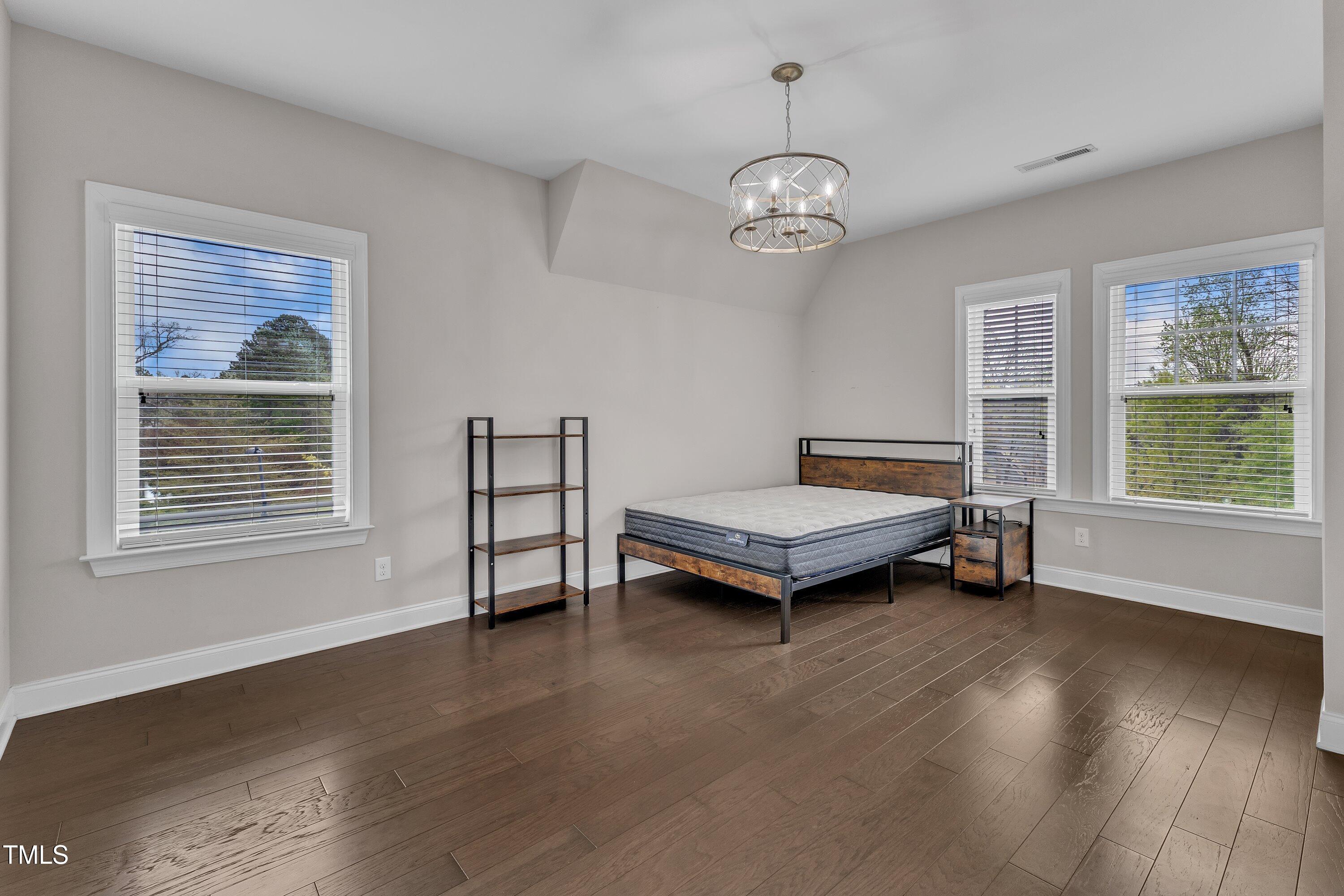 8121 Greys Landing Way Raleigh, NC 27615 - Photo 53 of 95 a living room with furniture and a window