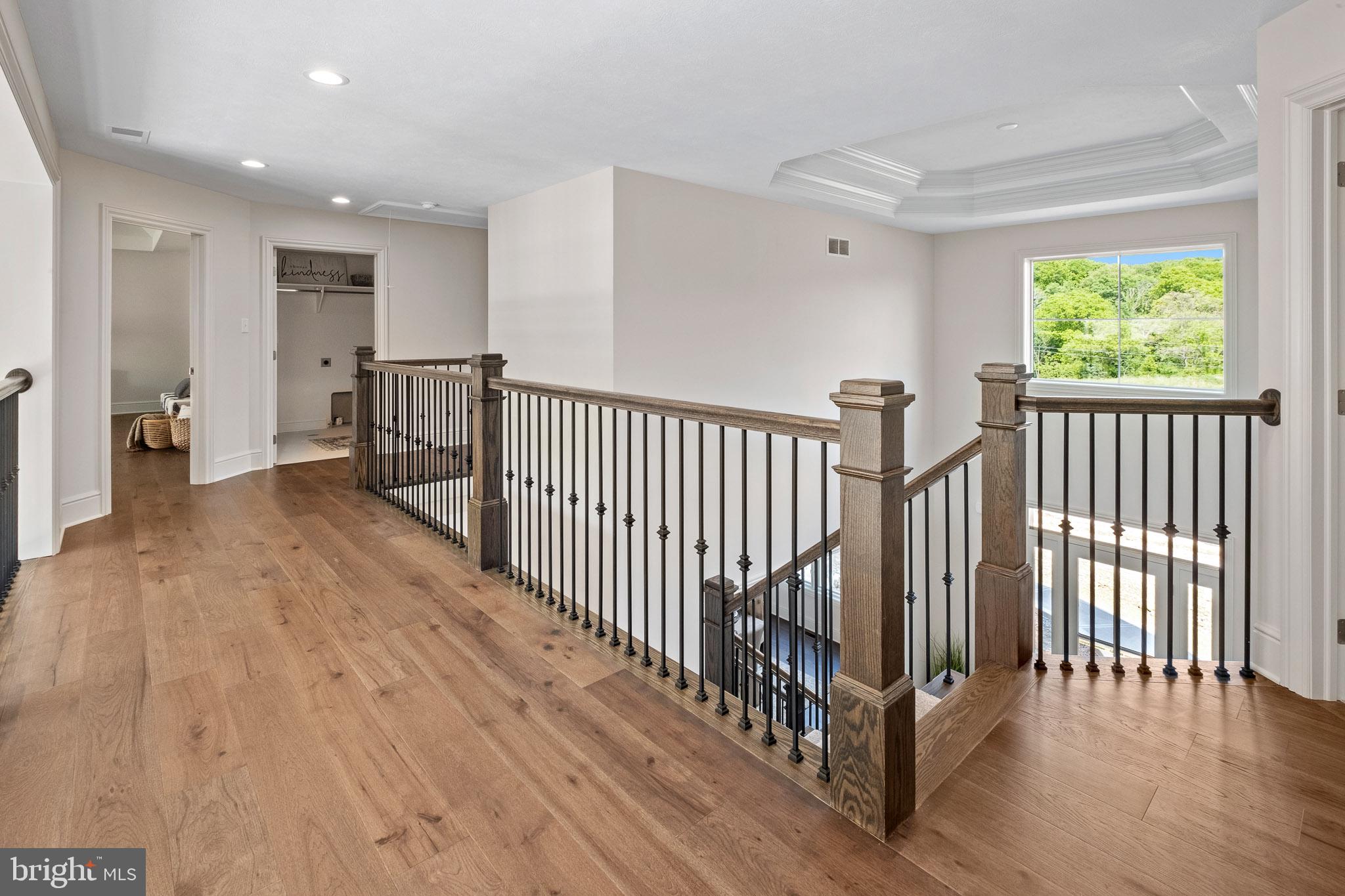 547 Webb Road Chadds Ford, PA 19317 - Photo 24 of 63 a view of a hallway with wooden floor and windows