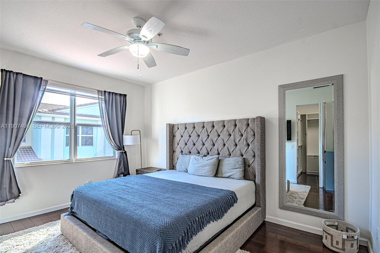 1430 Northwest 48th Drive Boca Raton, FL 33431 - Photo 15 of 33 a bedroom with a large bed and a large window