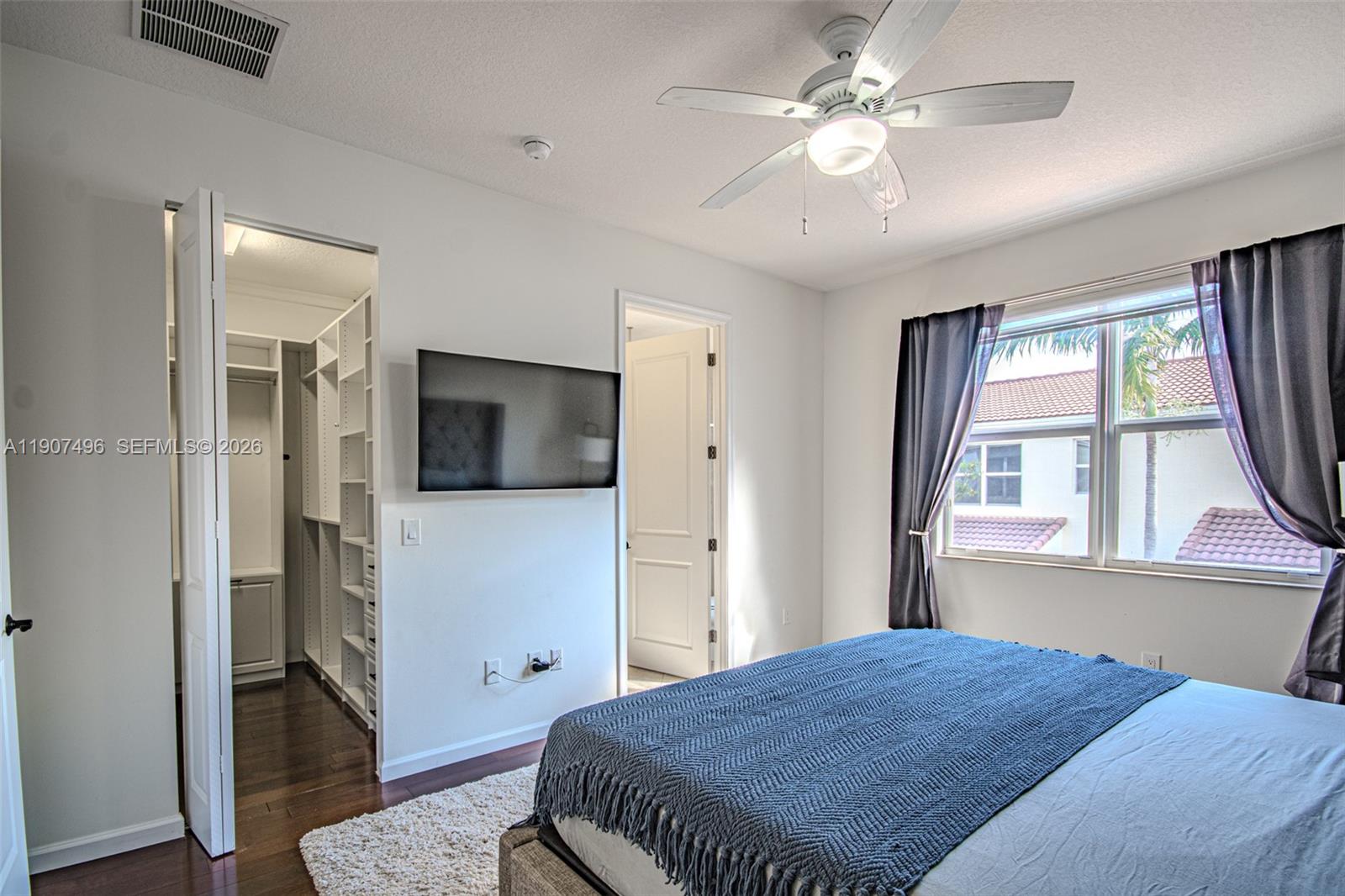 1430 Northwest 48th Drive Boca Raton, FL 33431 - Photo 16 of 33 a bedroom with a bed and a television