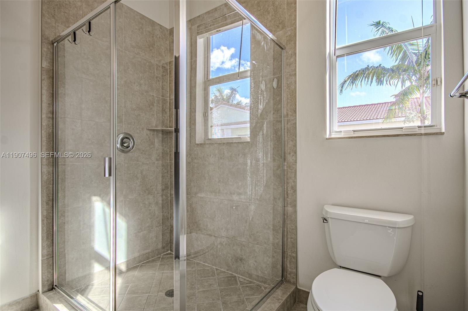 1430 Northwest 48th Drive Boca Raton, FL 33431 - Photo 18 of 33 a bathroom with a toilet and a shower