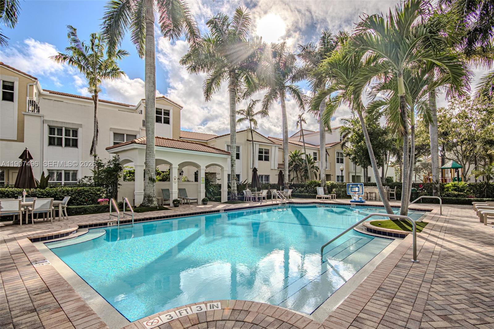 1430 Northwest 48th Drive Boca Raton, FL 33431 - Photo 25 of 33 a view of a swimming pool with a lounge chairs