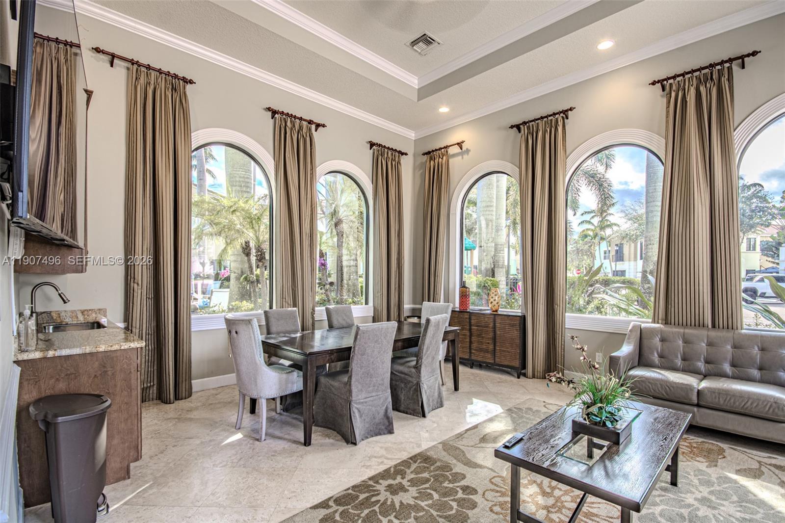 1430 Northwest 48th Drive Boca Raton, FL 33431 - Photo 28 of 33 a living room with furniture a fireplace and large windows