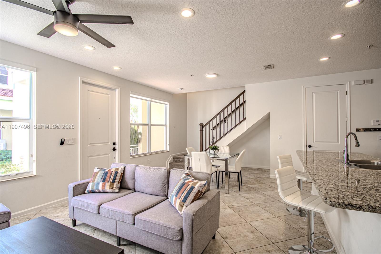 1430 Northwest 48th Drive Boca Raton, FL 33431 - Photo 7 of 33 a living room with furniture and a large window