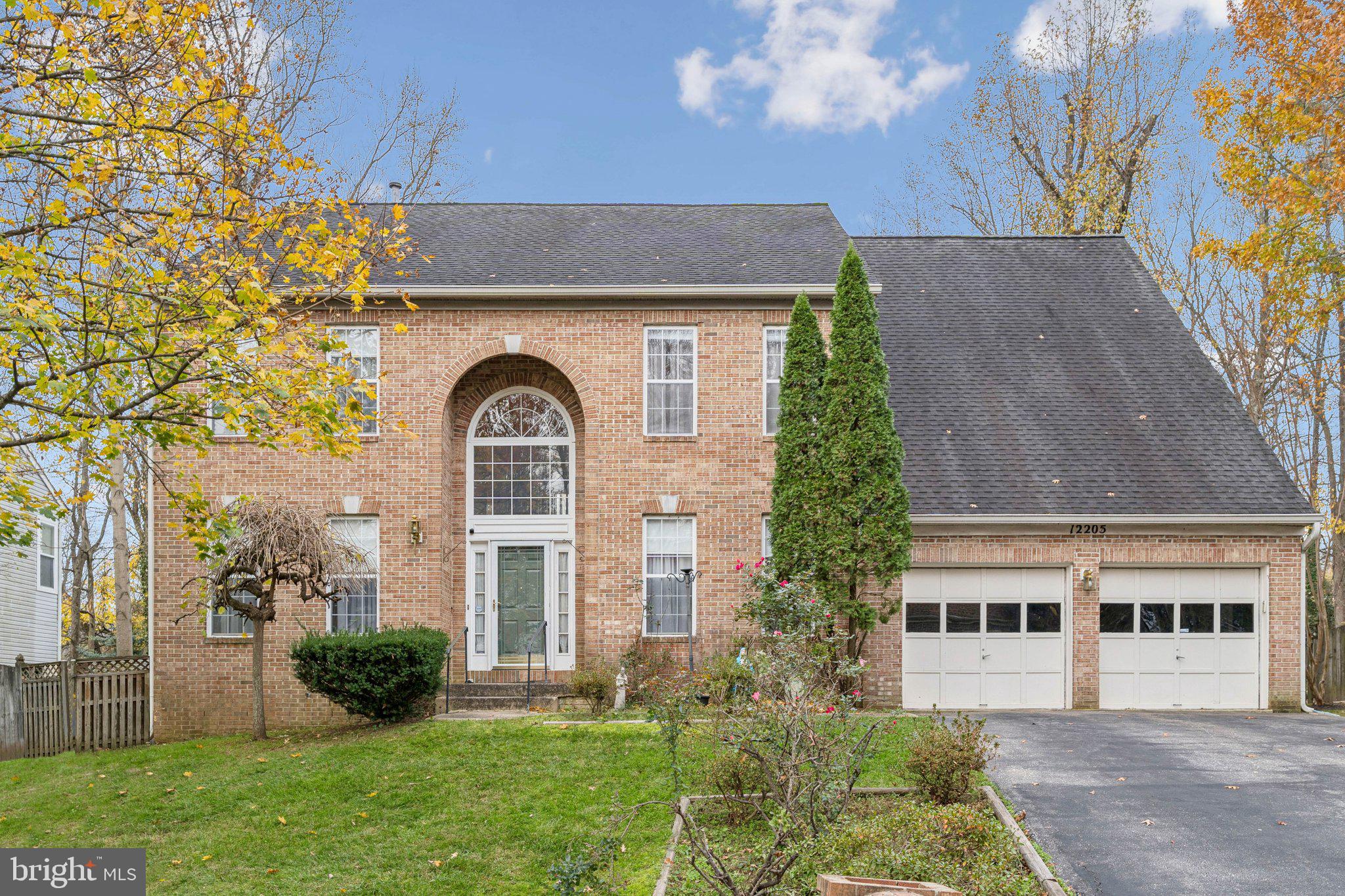 front view of a house with a garden