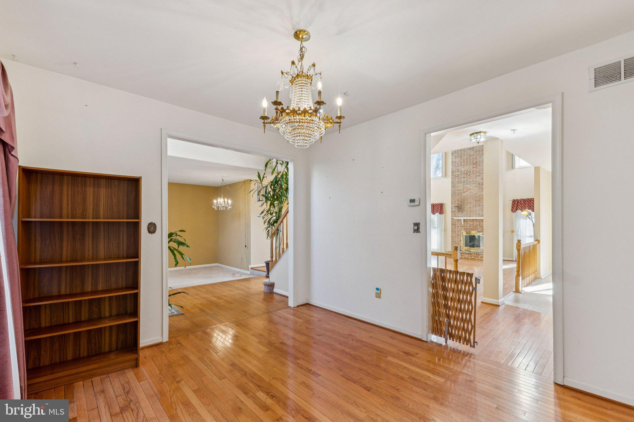 12205 Quick Fox Lane Bowie, MD 20720 - Photo 12 of 39 wooden floor in an empty room with a window