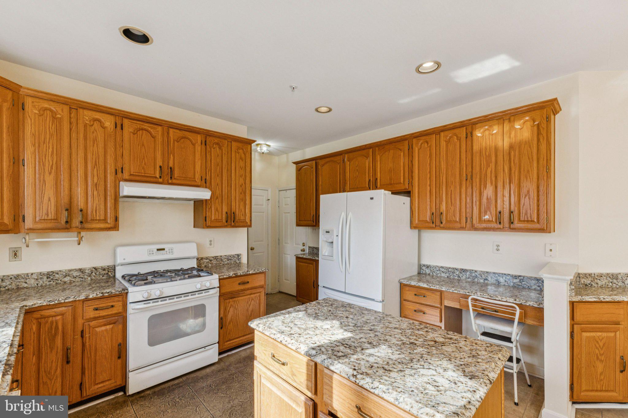 12205 Quick Fox Lane Bowie, MD 20720 - Photo 16 of 39 a kitchen with a refrigerator sink and stove