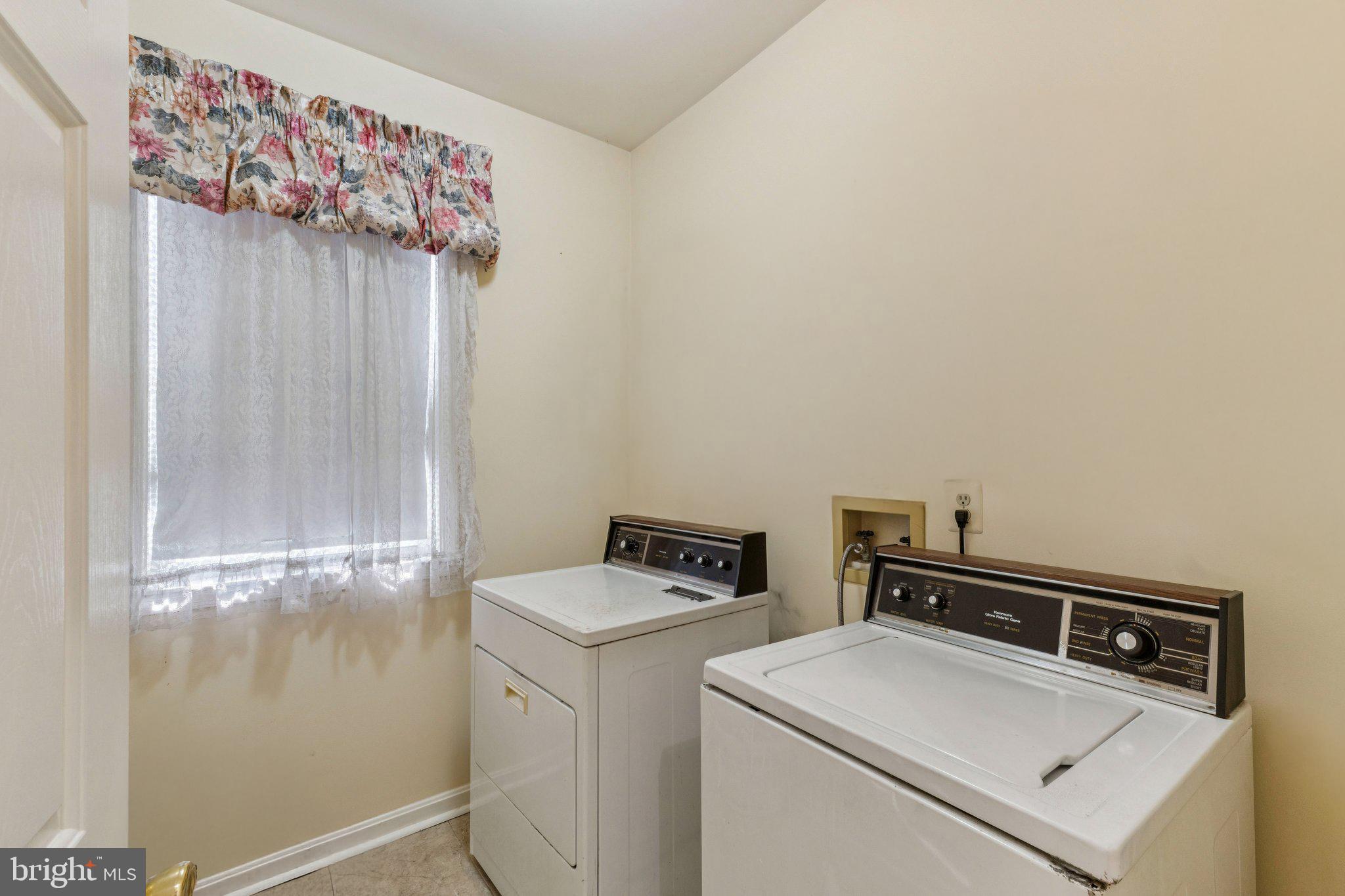 12205 Quick Fox Lane Bowie, MD 20720 - Photo 18 of 39 a utility room with dryer and washer