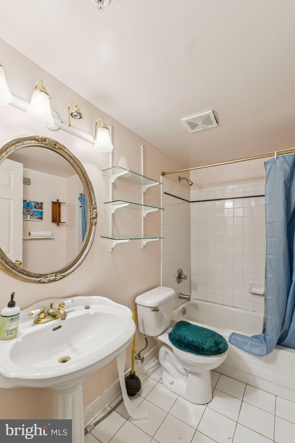 12205 Quick Fox Lane Bowie, MD 20720 - Photo 19 of 39 a bathroom with a sink toilet and mirror