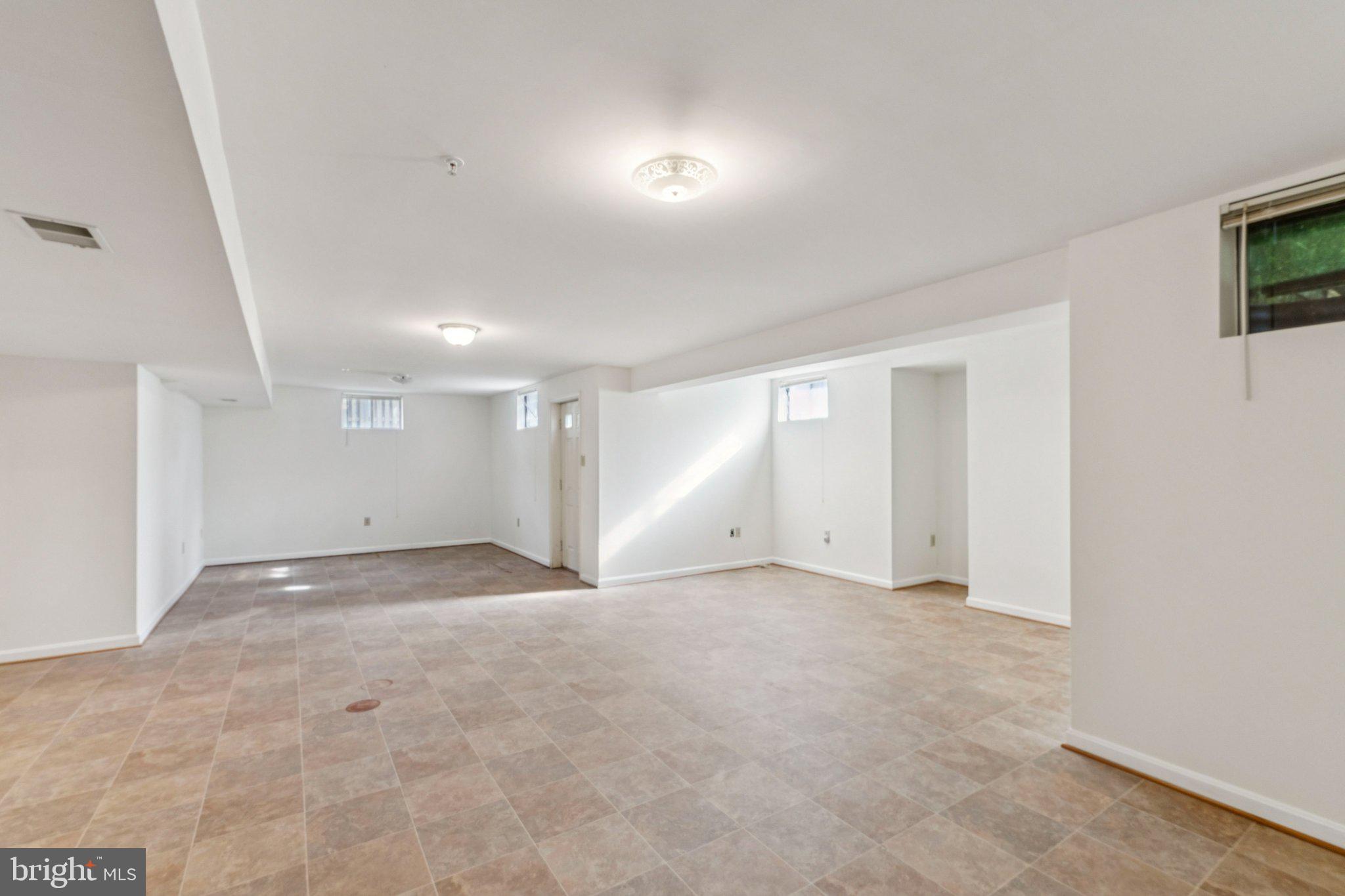 12205 Quick Fox Lane Bowie, MD 20720 - Photo 21 of 39 a view of an empty room with a window