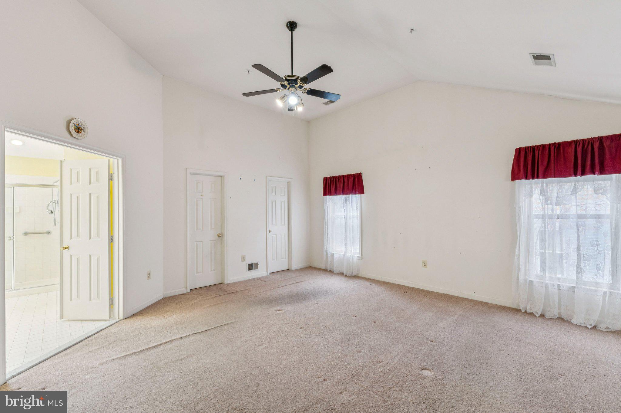 12205 Quick Fox Lane Bowie, MD 20720 - Photo 24 of 39 an empty room with fan and windows