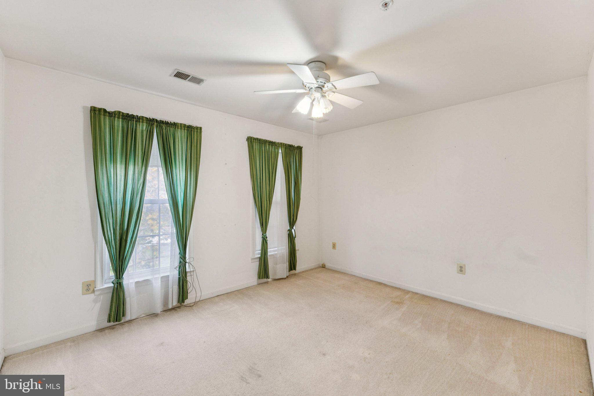 12205 Quick Fox Lane Bowie, MD 20720 - Photo 30 of 39 an empty room with windows and entrance