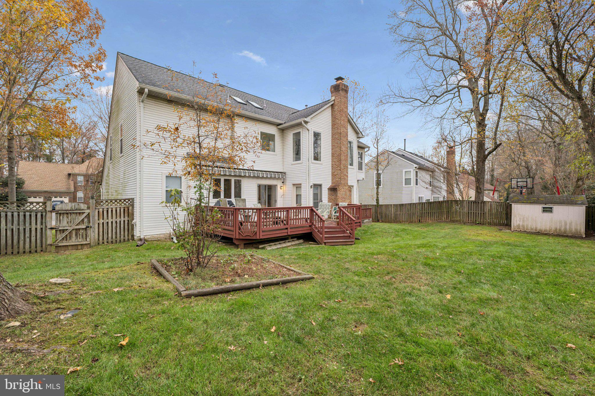 12205 Quick Fox Lane Bowie, MD 20720 - Photo 36 of 39 a view of a house with backyard and porch