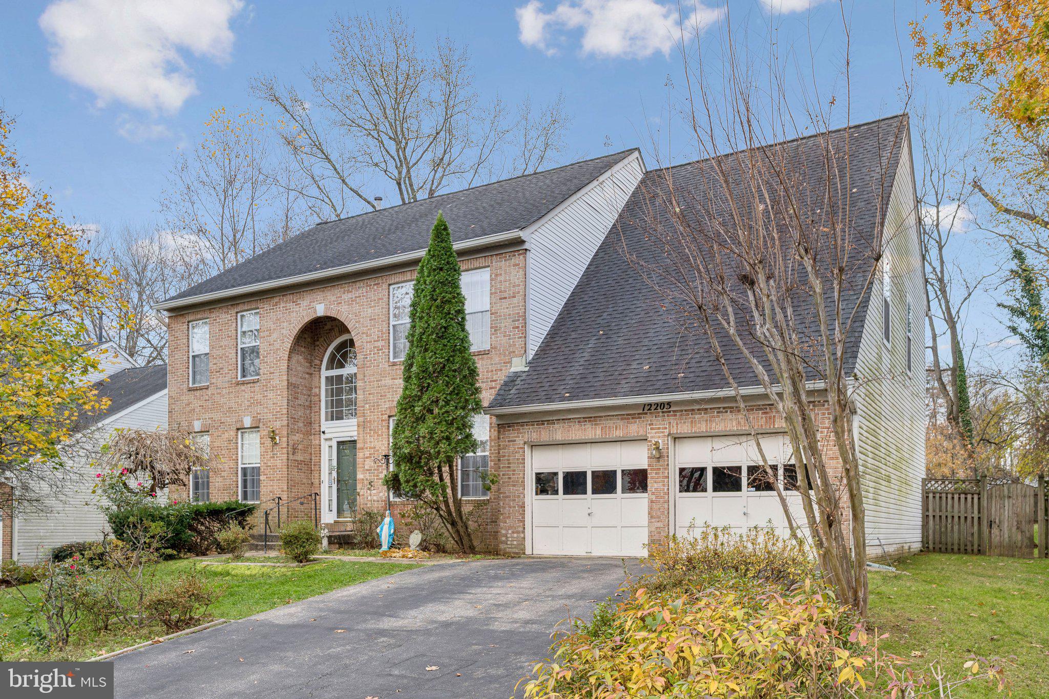 12205 Quick Fox Lane Bowie, MD 20720 - Photo 37 of 39 a front view of a house with garden
