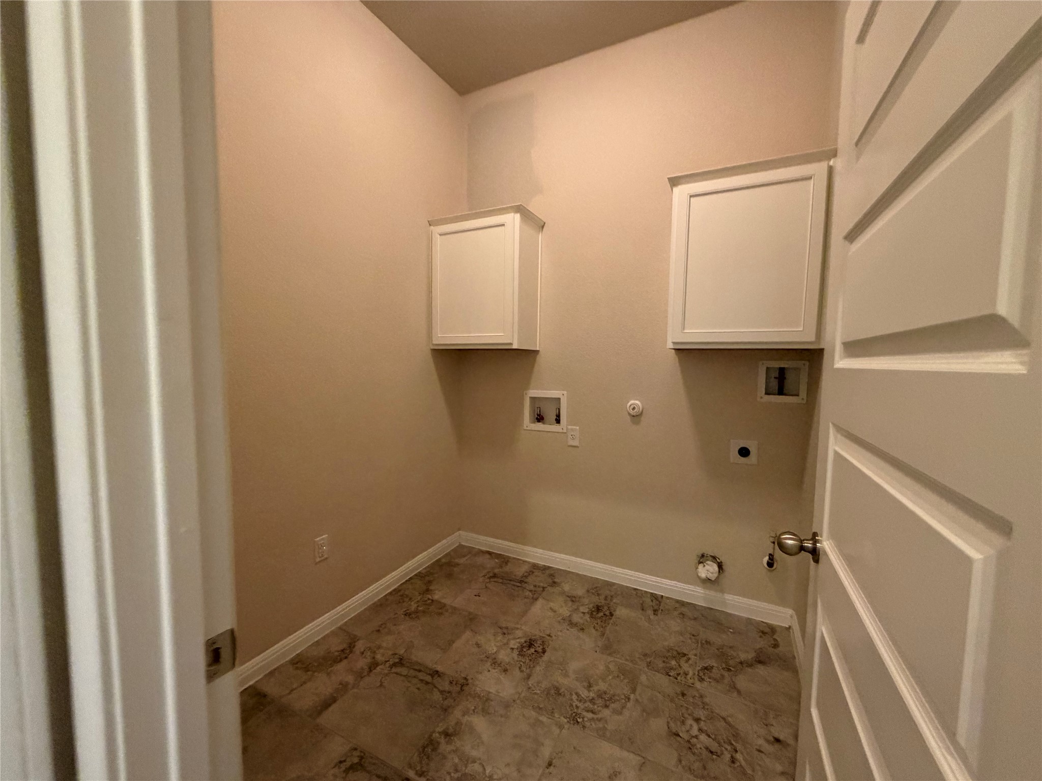 419 Gettysburg Loop Elgin, TX 78621 - Photo 10 of 21 Ample utility room space with upper cabinetry, ready for your appliances.