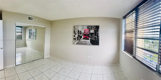 a view of a room with a large window