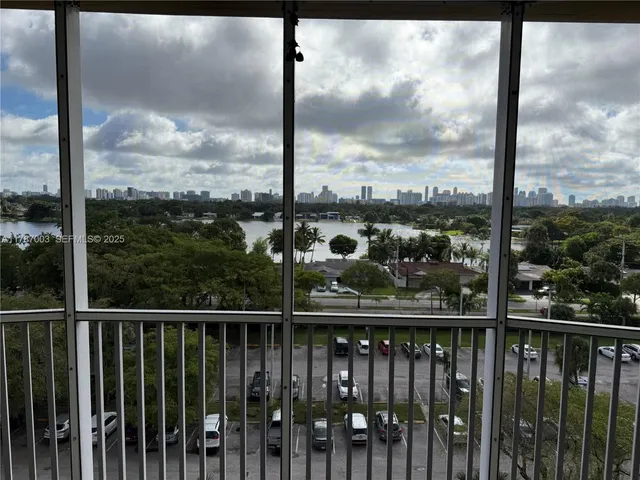 a view of an empty room and a window