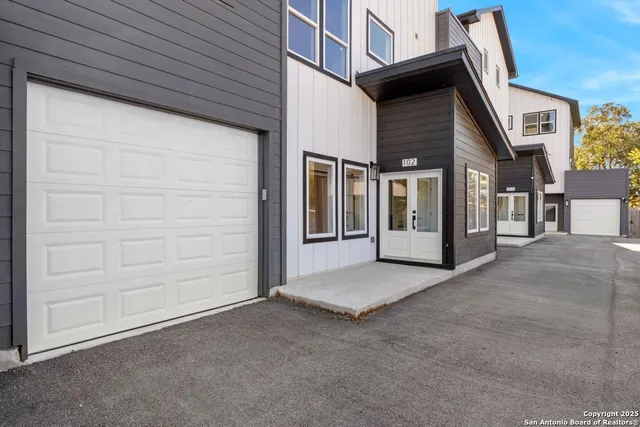 a view of a house with a street
