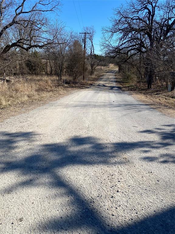 8929 West Fm 898 Ector, TX 75439 - Photo 2 of 12 a view of a yard with wooden fence