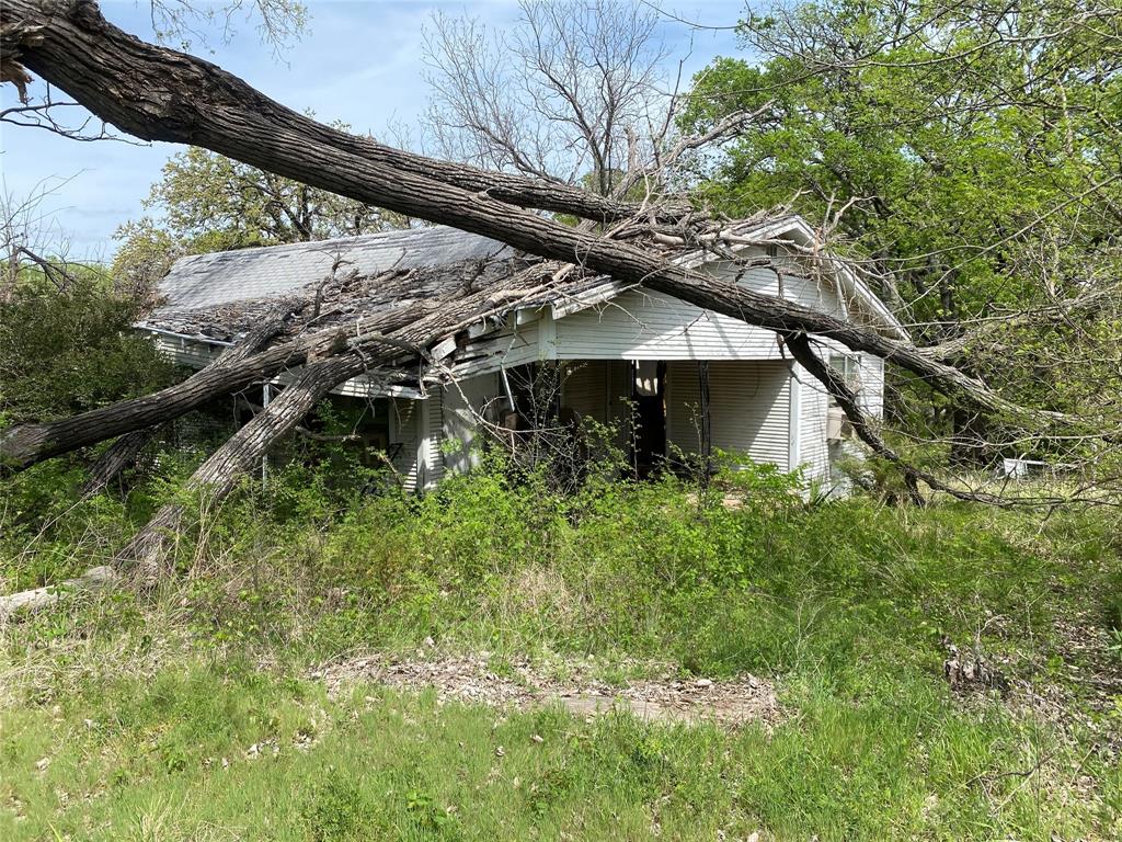 8929 West Fm 898 Ector, TX 75439 - Photo 7 of 12 a yellow house with lots of trees