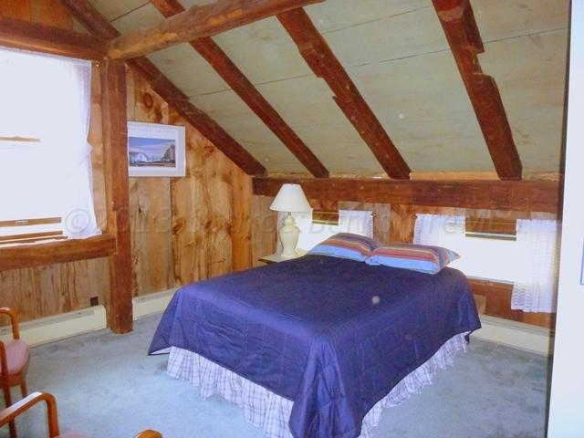 2993 Hancock Road Hancock, MA 01267 - Photo 19 of 32 a bed sitting in a bedroom next to a window