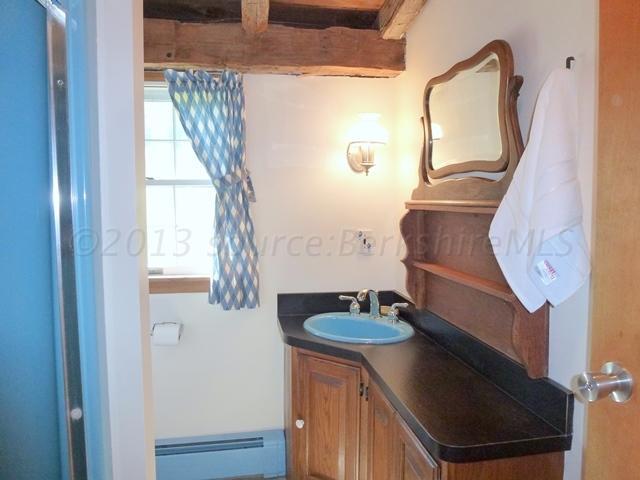 2993 Hancock Road Hancock, MA 01267 - Photo 22 of 32 a bathroom with a sink a mirror and shower