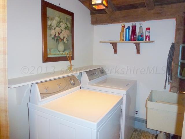 2993 Hancock Road Hancock, MA 01267 - Photo 24 of 32 a bathroom with a sink and a refrigerator