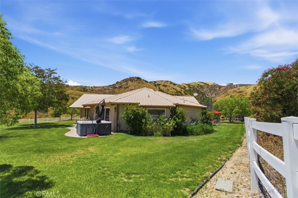 31233 Romero Canyon Road Castaic, CA 91384 - Photo 6 of 38 a view of an house with backyard space and garden