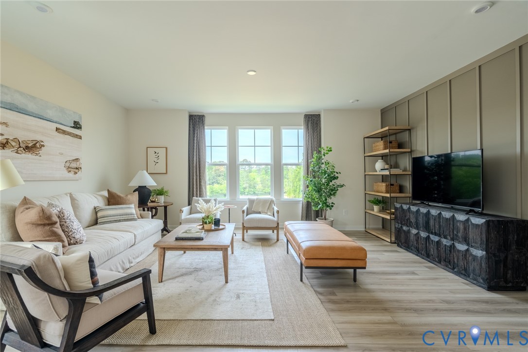 0 Flying Cloud Alley, Unit 9 Midlothian, VA 23113 - Photo 12 of 22 a living room with furniture and a flat screen tv