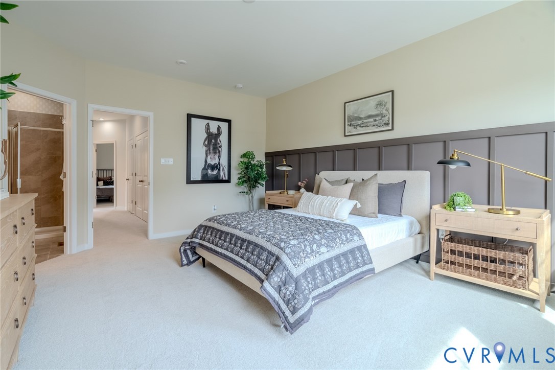 0 Flying Cloud Alley, Unit 9 Midlothian, VA 23113 - Photo 17 of 22 a spacious bedroom with a bed and a couch