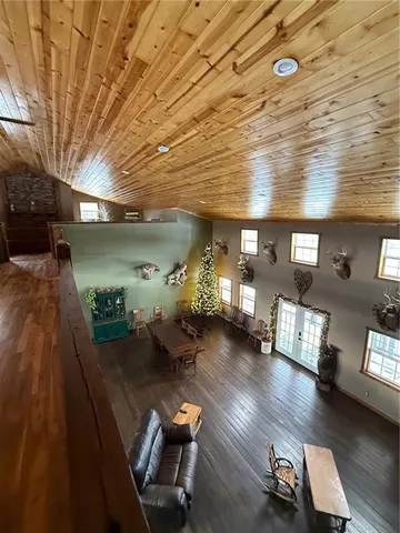 a view of a room with wooden floor