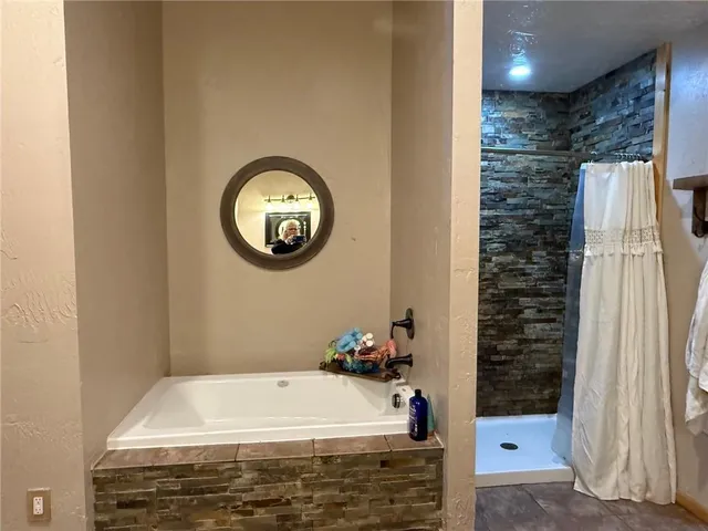 a bed room with a bed and a chandelier