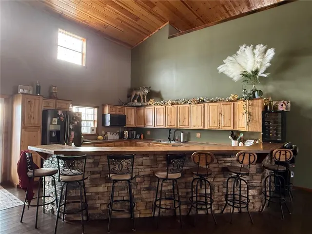 a kitchen with a table and chairs in it