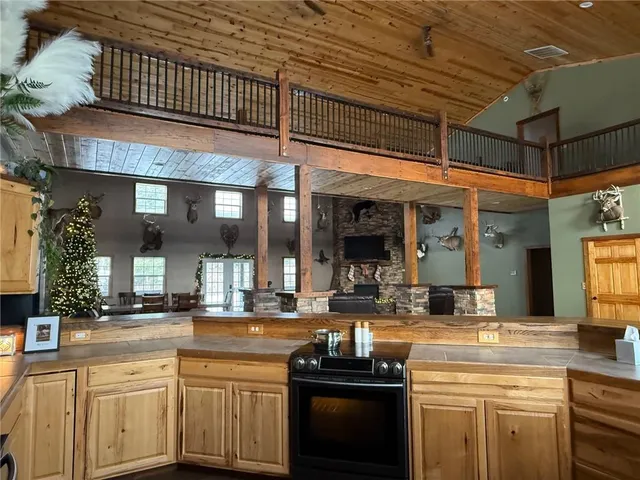 a kitchen with stainless steel appliances granite countertop a sink and cabinets
