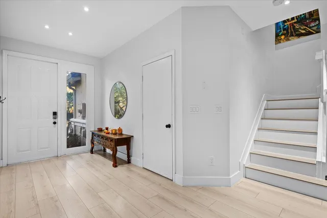 a view of room with window and wooden floor