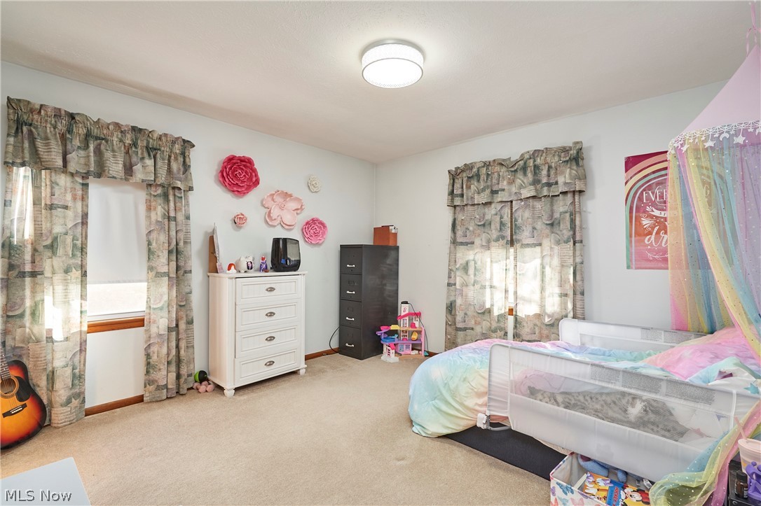 1359 Beaconfield Road Lyndhurst, OH 44124 - Photo 8 of 26 Bedroom with light carpet and baseboards