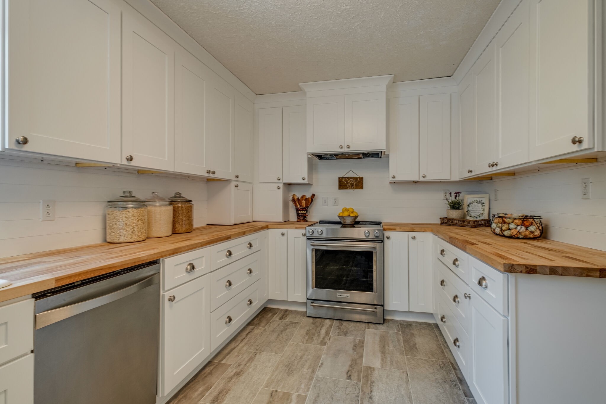 2540 Thompson Road Murfreesboro, TN 37128 - Photo 11 of 48 a kitchen with granite countertop white cabinets and white appliances