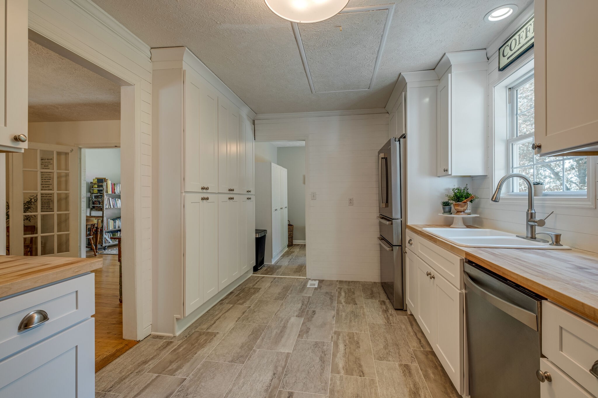 2540 Thompson Road Murfreesboro, TN 37128 - Photo 12 of 48 a view of a kitchen with a sink and dishwasher with wooden floor