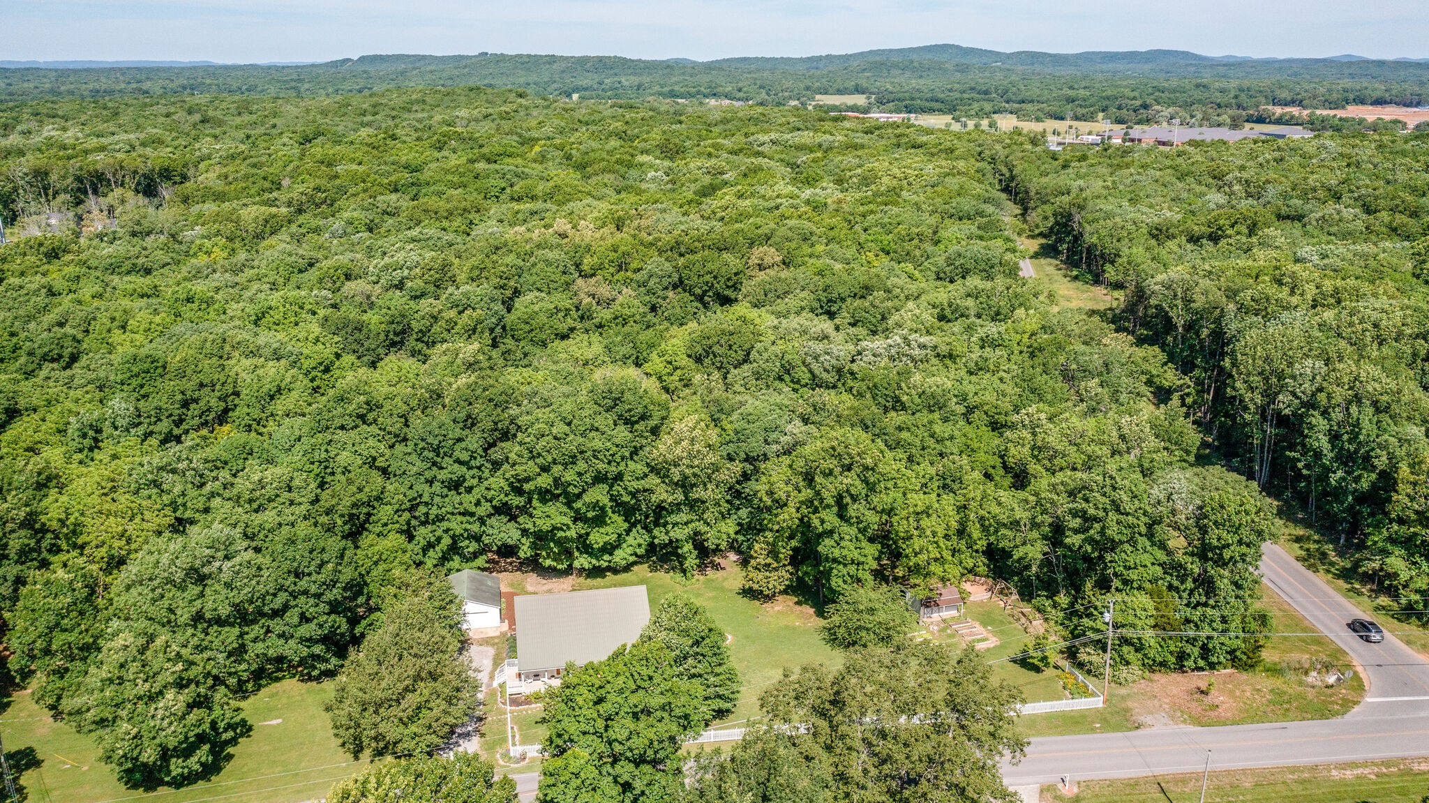 2540 Thompson Road Murfreesboro, TN 37128 - Photo 38 of 48 an aerial view of residential houses with outdoor space and trees