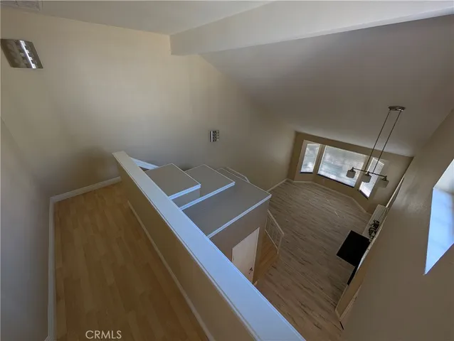 a view of balcony with wooden floor