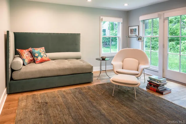 a view of a dining room with furniture window and wooden floor