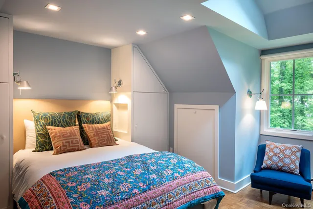 a bathroom with a toilet a sink and a window