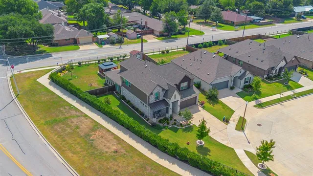 an aerial view of a house with a swimming pool