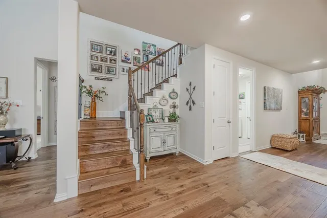 a view of entryway with livingroom and wooden floor