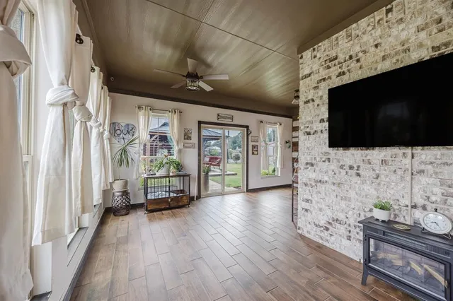 a view of a livingroom with furniture and flat screen tv