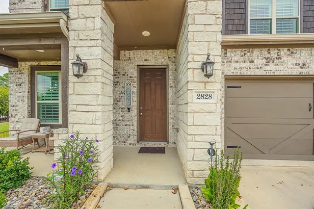 a view of a entryway door front of house