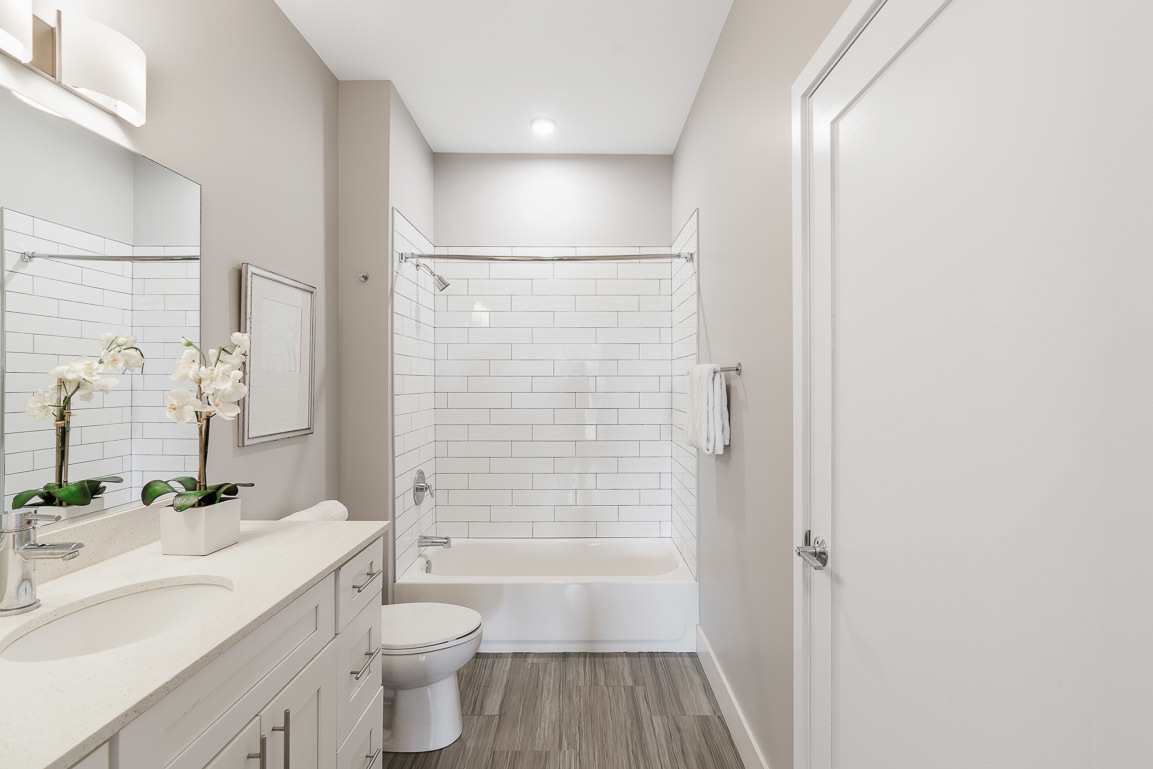 101 West Liberty Street, Unit 221 Barrington, IL 60010 - Photo 10 of 17 a bathroom with a sink a toilet and shower