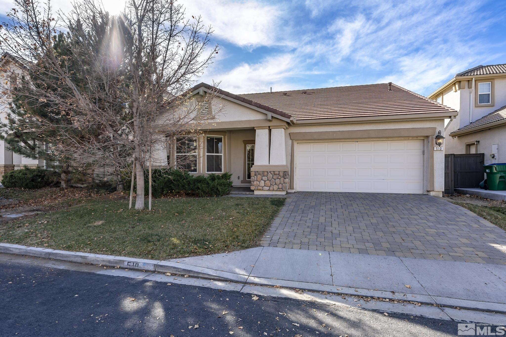 510 Roseben Drive Reno, NV 89521 - Photo 2 of 20 a front view of house with a garden